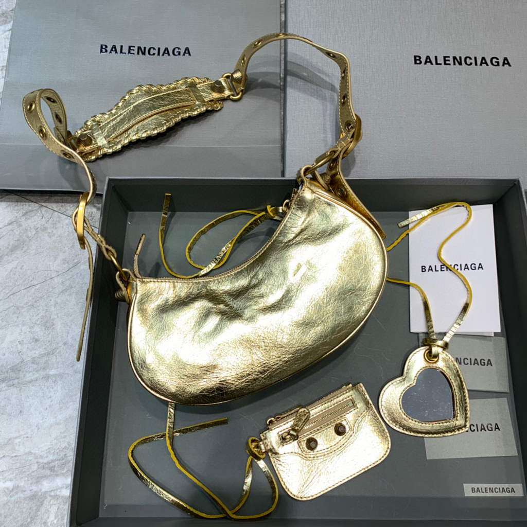 Balenciaga 700940210 Women’s Neo Cagole XS Handbag in gold Arena lambskin Balenciaga 700940210 Women’s Neo Cagole Xs Handbag In Gold Arena Lambskin