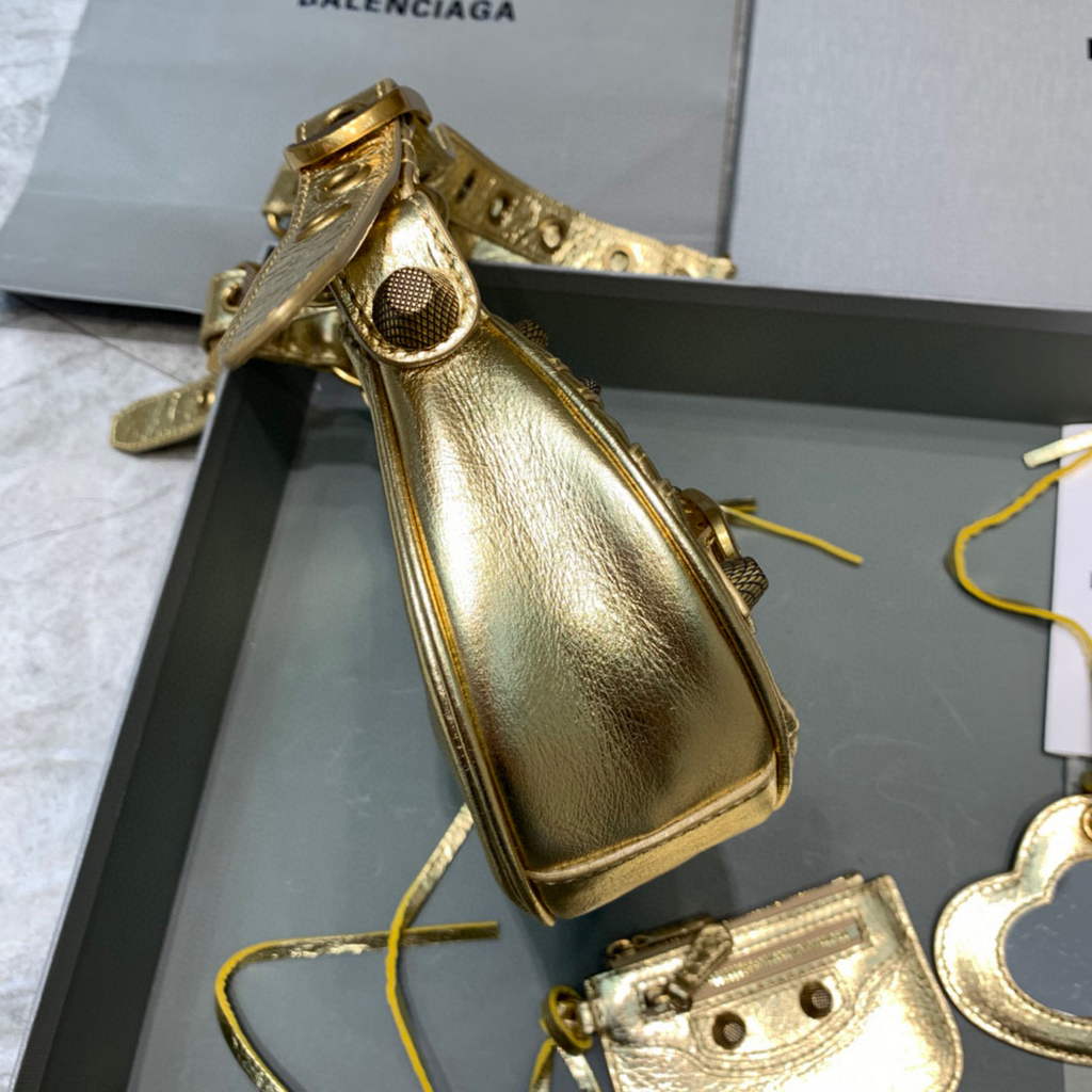 Balenciaga 700940210 Women’s Neo Cagole XS Handbag in gold Arena lambskin Balenciaga 700940210 Women’s Neo Cagole Xs Handbag In Gold Arena Lambskin